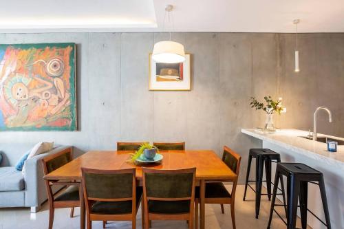 a dining room table and chairs in a kitchen at 'The Fern' Split-Level Retreat with Lush Courtyard in Sydney