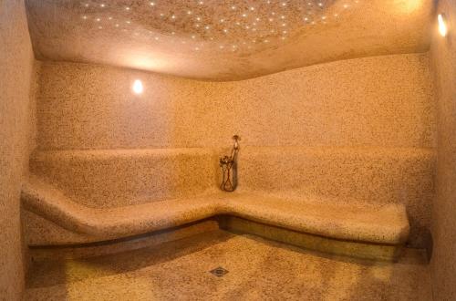 a bathroom with a bath tub in a room at Aquamarine hotel&spa in Kursk