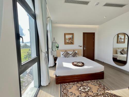 Postel nebo postele na pokoji v ubytování Thành Công Hotel