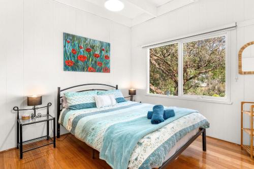 a bedroom with a bed and a window at Seabreeze at silverleaves in Rhyll