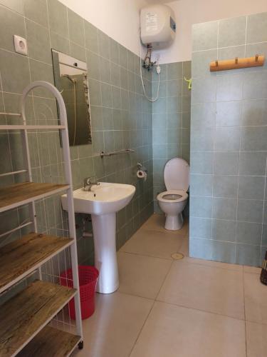 a bathroom with a sink and a toilet at OKEANOS in Sal Rei