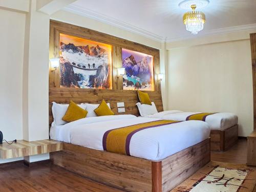 a bedroom with two beds in a room at Prem Durbar Hotel & Nagarkot Zipline in Nagarkot