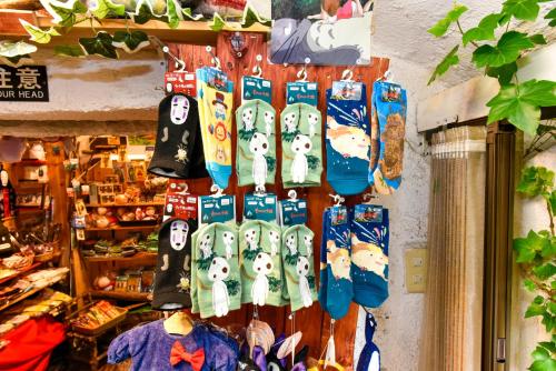 a group of socks hanging on a wall in a store at ＹＵＦＵＩＮ　ＦＬＯＲＡＬ　ＶＩＬＬＡＧＥ　ＨＯＴＥＬ in Yufu