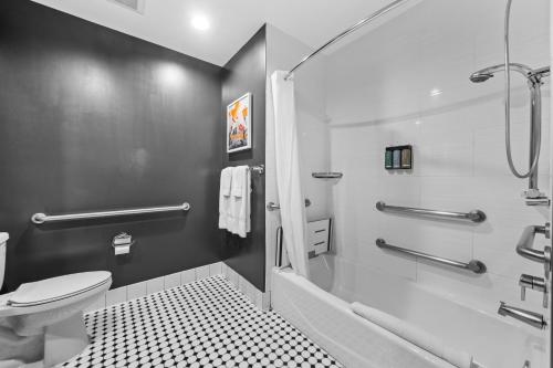 a bathroom with a toilet and a shower at Hollywood Le Bon Hotel in Los Angeles