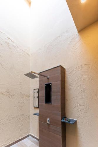 a room with a wooden door in the ceiling at Vanaashrya Resort and Spa Sariska in Tehla