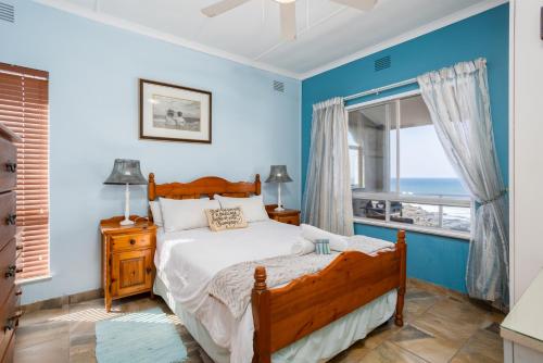 a bedroom with a bed and a window at Breathtaking views from Sue Casa 11 in Margate