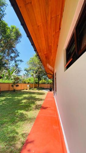 a red carpet on the side of a building at RED ROSE HOLIDAY HOUSE in Matara