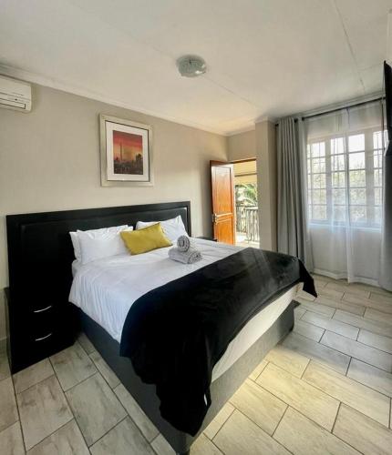 Katil atau katil-katil dalam bilik di The Eden Boulders Hotel and Resort Midrand