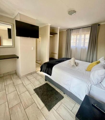 Katil atau katil-katil dalam bilik di The Eden Boulders Hotel and Resort Midrand