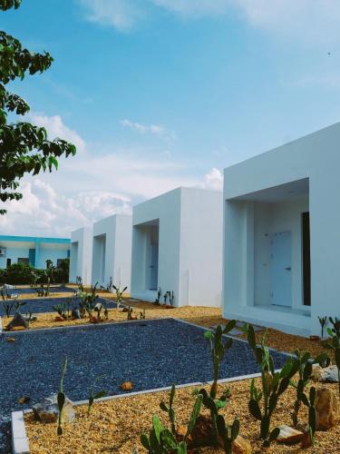 a rendering of a white building with cactus at TJ Garden & Resort in Ban Dan Chang