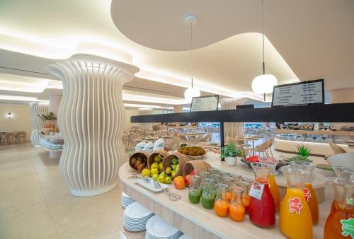 a store with a counter with different types of drinks at RH Silene Hotel & Spa 4 Sup in Castellón de la Plana
