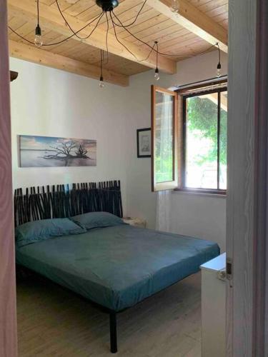 Ένα ή περισσότερα κρεβάτια σε δωμάτιο στο Graziosa casa in campagna