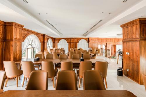 a room with rows of tables and chairs at Sea Breeze Hotel & Villa in Sihanoukville