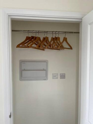 a door leading into a room with a chandelier at Studio apartment in Harefield in Harefield