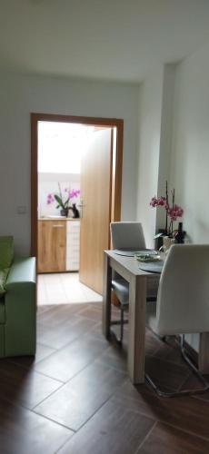 a room with a table with a laptop on it at Apartmán Mariposa 1 in Lipoltice