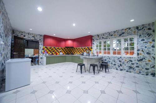 a kitchen with a table and chairs in a room at Villa 23 - 4B/4B/PrivatePool/BBQ in Petaling Jaya