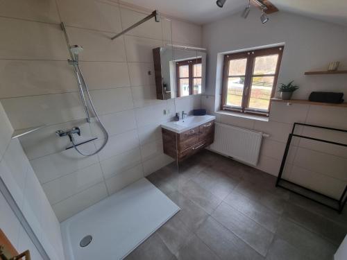 a bathroom with a shower and a sink at Ferienwohnung Gschwendt 