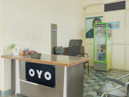 a xo sign on a desk in an office at Hotel O Sea Coastal Inn in Kākināda