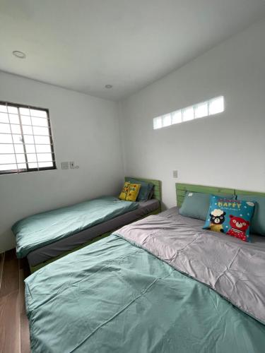 Postel nebo postele na pokoji v ubytování HO GIA AN Home - Green Room - Ngay trung tâm Phố Ẩm Thực