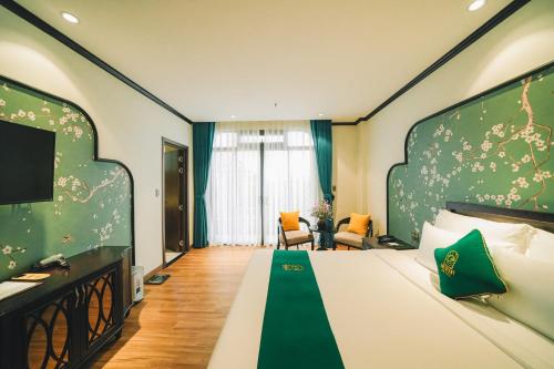 Кровать или кровати в номере Goldient Boutique Hotel