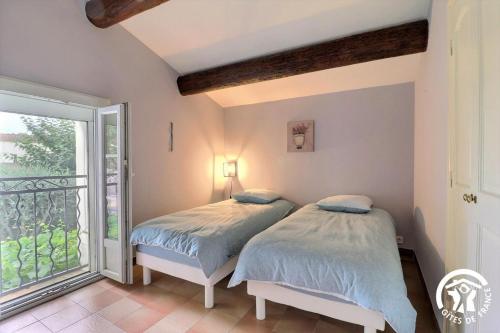 Postel nebo postele na pokoji v ubytování Villa Mariella