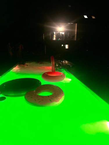 a green game with a donut on a table at The View in Iława