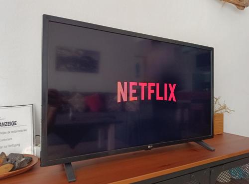 a television screen with the netflix sign on it at Aqua Apt Sunrise & Sea Views in Costa Teguise