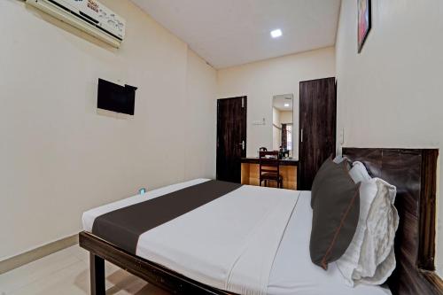 a bedroom with a large bed in a room at Collection O G Silver Near Airport in Chennai