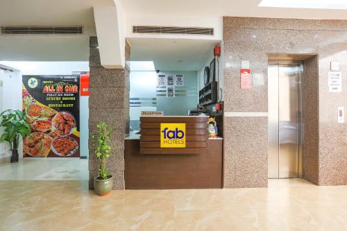a fast food restaurant with a pizza counter at FabHotel All In One in New Delhi