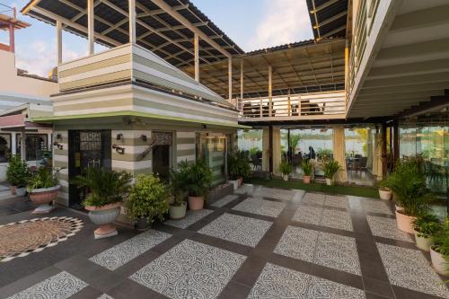 a lobby of a building with potted plants at Panna Vilas - A Lake Facing Boutique Hotel in Udaipur