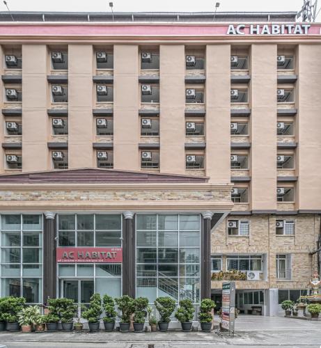 an exterior view of an apartment building at AC Habitat Bangkok in Bangkok