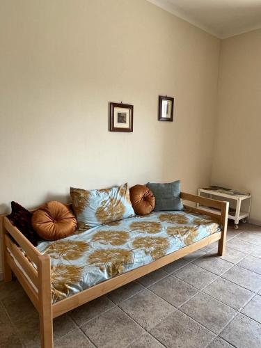 a bed with pillows on it in a room at Fattoria Didattica La Collina Incantata in Narni
