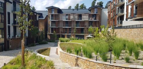 a garden in a city with buildings at Molo Lipno in Lipno nad Vltavou