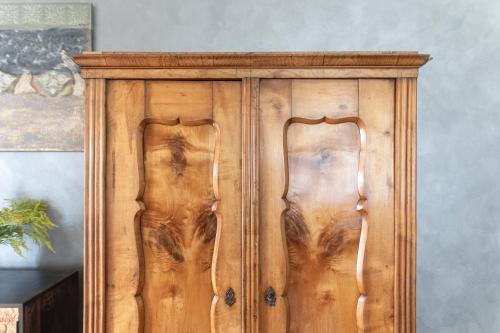 a wooden cabinet in a room next to a wall at Vila Heide in Česká Kamenice