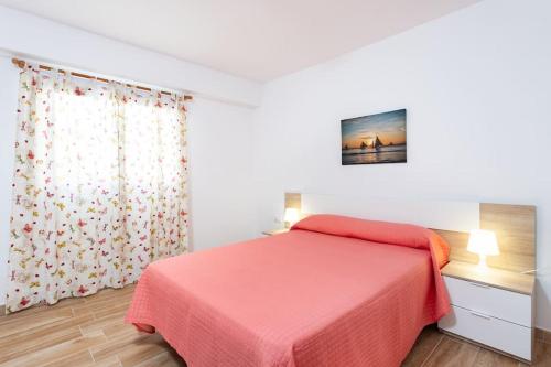 Postel nebo postele na pokoji v ubytování Vivienda Vacacional Rosaini