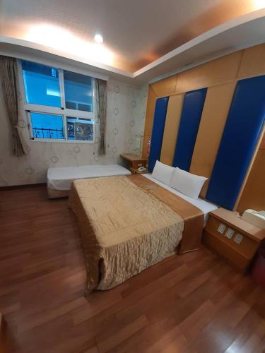 Ένα ή περισσότερα κρεβάτια σε δωμάτιο στο Xinghe Motel - Chaozhou