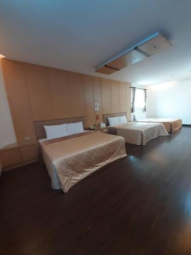 Ένα ή περισσότερα κρεβάτια σε δωμάτιο στο Xinghe Motel - Chaozhou