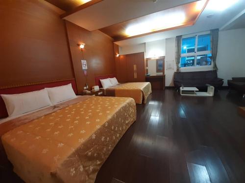 Ένα ή περισσότερα κρεβάτια σε δωμάτιο στο Xinghe Motel - Chaozhou