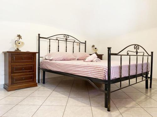 A bed or beds in a room at Casa di Vacanza Marina di Davoli