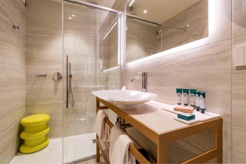 a bathroom with a sink and a shower at Palazzo Keller in Venice