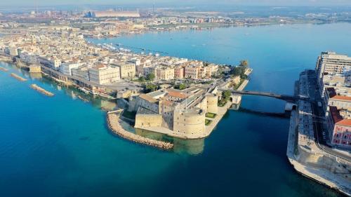 an aerial view of a city in the water at Suite San Cataldo in Taranto