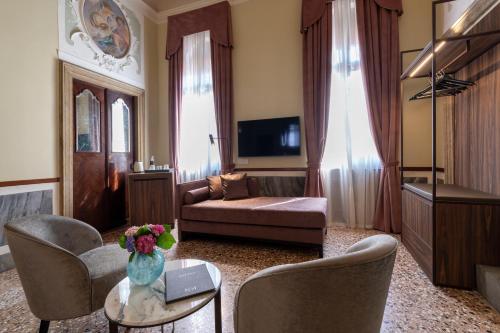 a living room with a couch and a table at Palazzo Keller in Venice
