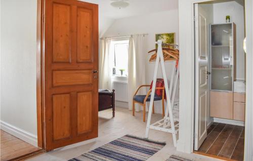 a room with a ladder next to a kitchen at Cozy Home In Sankt Ibb With Wifi in Sankt Ibb
