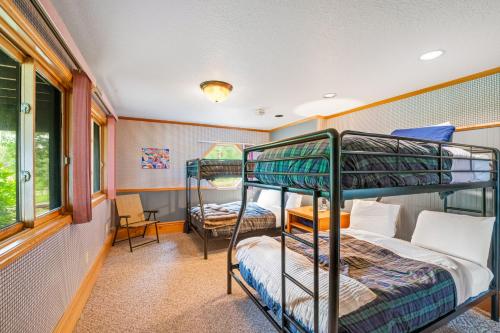 a room with two bunk beds and a window at Lazy K on Peaceful Bay - Full Property in Lakeside