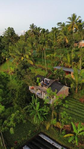 an overhead view of a house in a forest at Tetebatu Fullmoon in Tetebatu