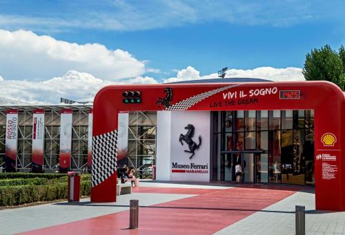 a building with a red archway in front of it at Coco21 in Modena