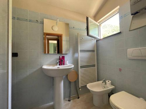 a bathroom with a sink and a toilet at Il Fiume by Holiday World in Castagnelo