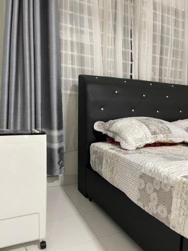 Una cama o camas en una habitación de Homestay Putrajaya