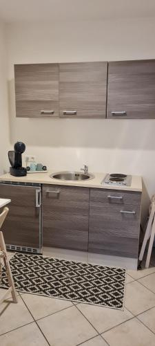 a kitchen with a sink and a counter at TOP 06 in Fohnsdorf