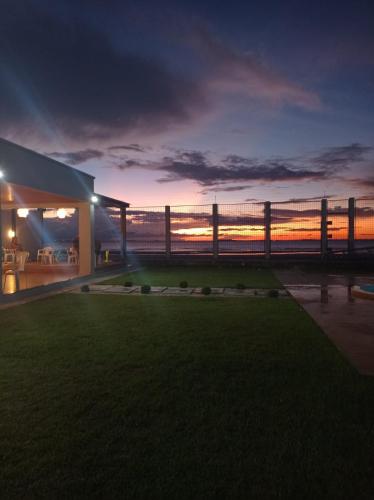 a house with a view of the ocean at night at Solar Calixto in Belém